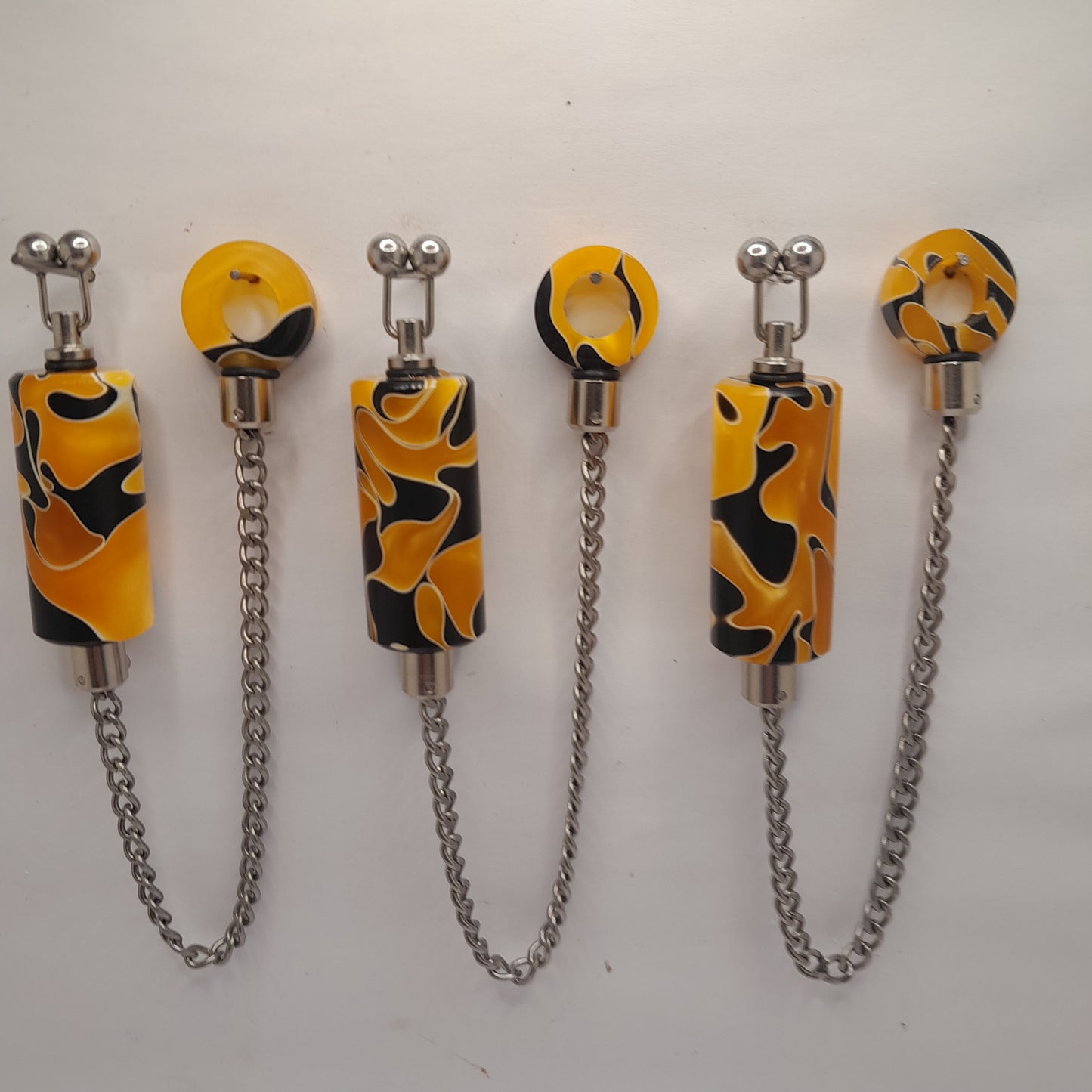 Set Of 3 Long Body Orange/Black/White Marbled Bobbins With Matching Hockey Sticks Ref A2